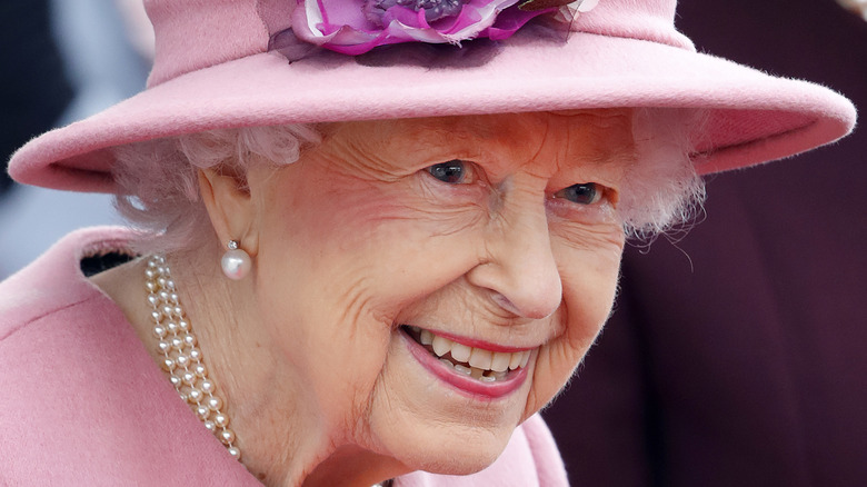 Queen Elizabeth wearing hat, smiling