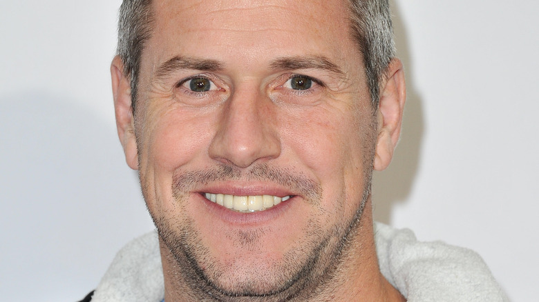 Ant Anstead smiles with a thin mustache