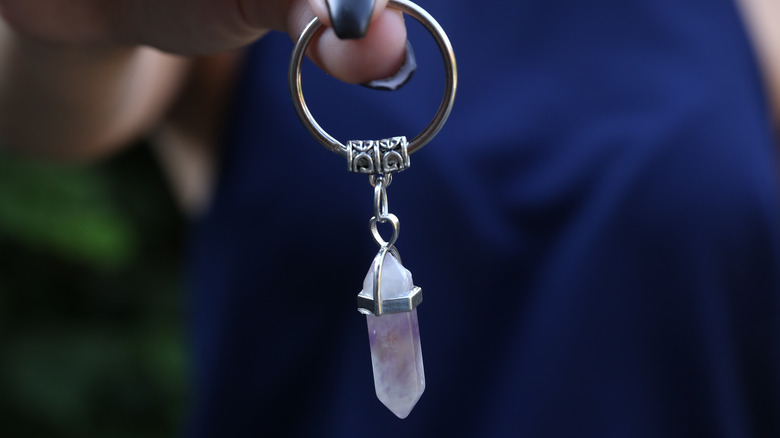 Woman holding quartz crystal