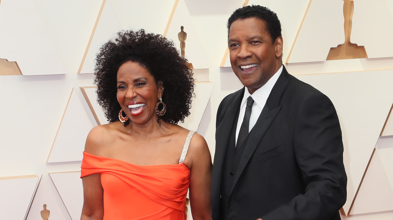 Pauletta and Denzel Washington laughing