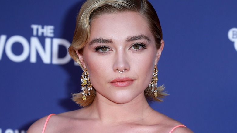 Florence Pugh poses at a movie premiere