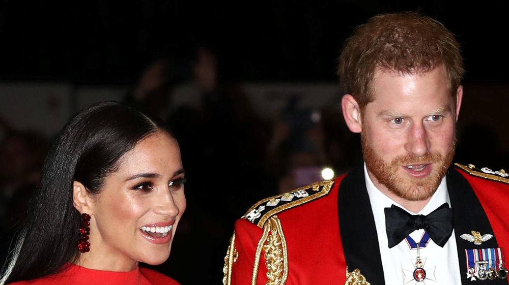 Prince Harry and Meghan Markle wear red
