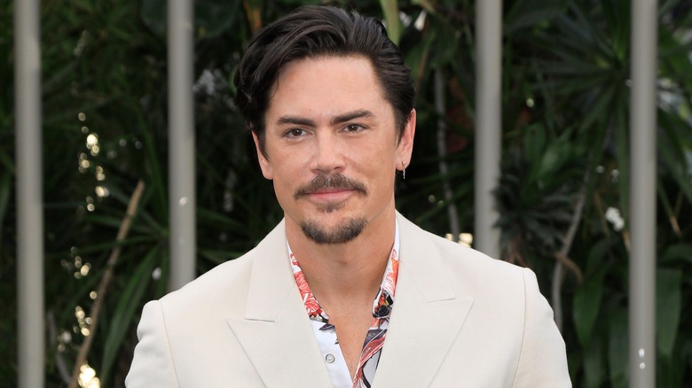 Tom Sandoval smiling at an event