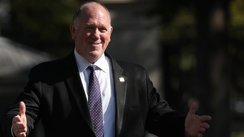 Tom Homan smiling with open arms
