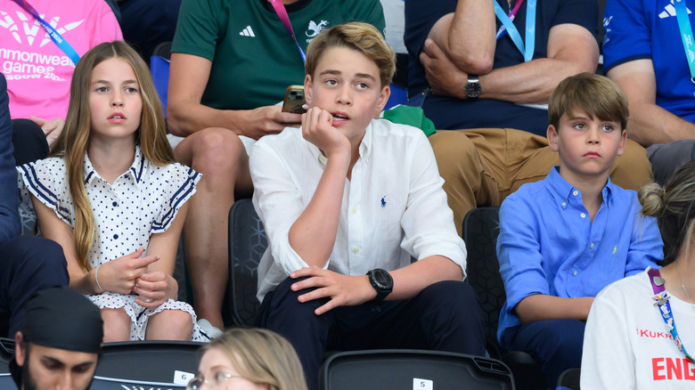 Princess Charlotte, Prince George, and Prince Louis sitting next to each other