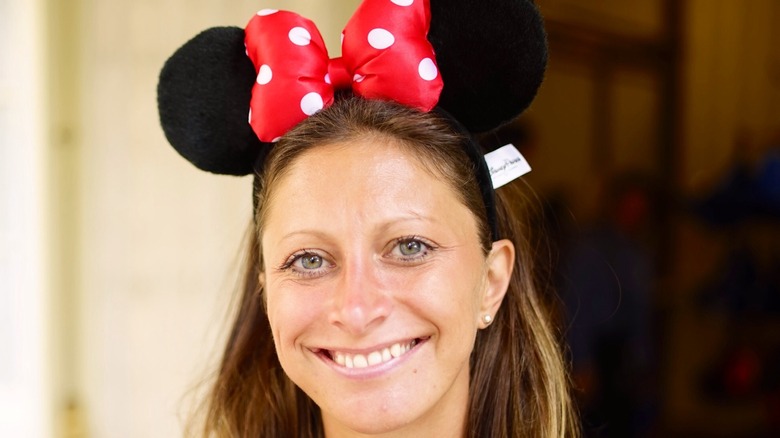 Woman wearing Minnie Mouse ears
