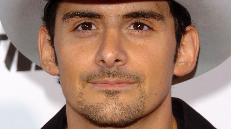 Brad Paisley smiling in a cowboy hat