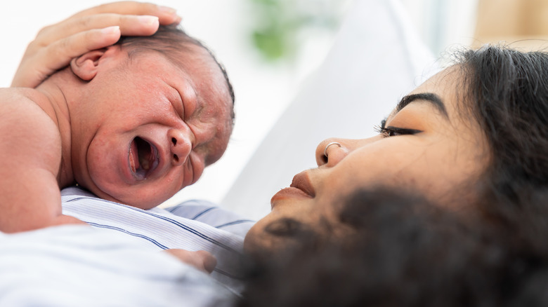 woman holding newborn