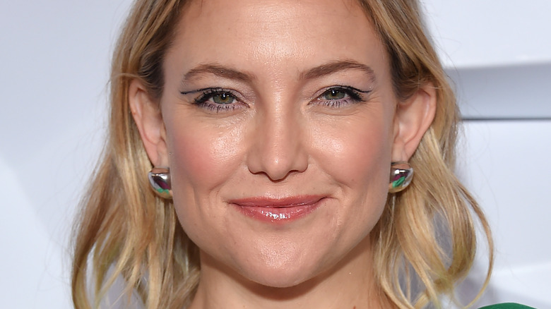 Kate Hudson grinning mouth closed