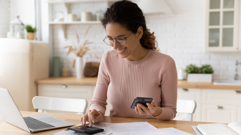 A woman on a calculator