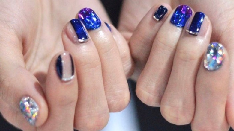 Two hands with high heel nails
