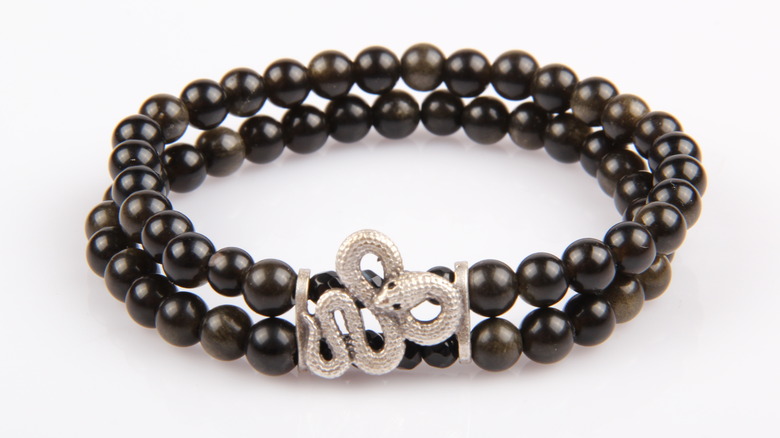 Black tourmaline bracelet with silver snake detail