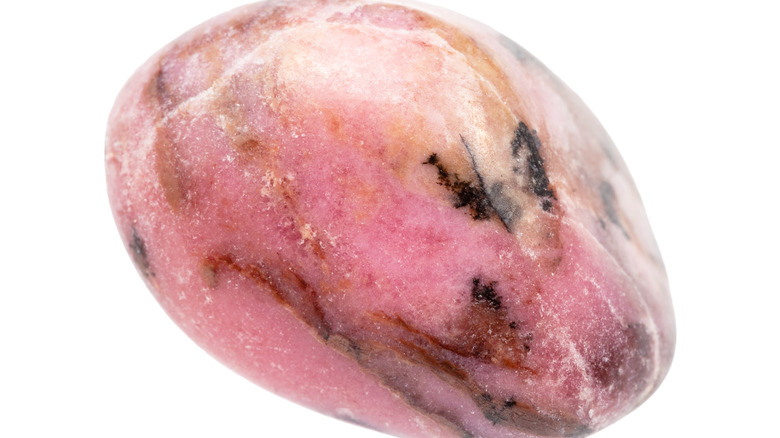 A piece of rolled rhodonite