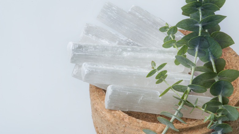 selenite in bowl with herbs