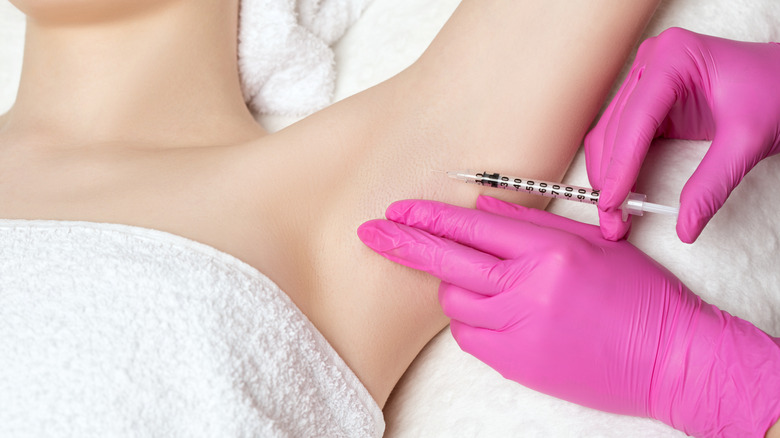 Woman getting Botox in armpit