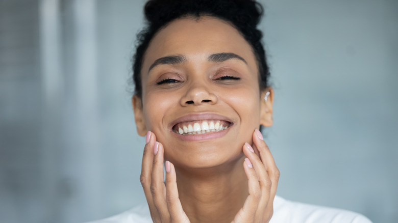 Woman smiling with glowing skin