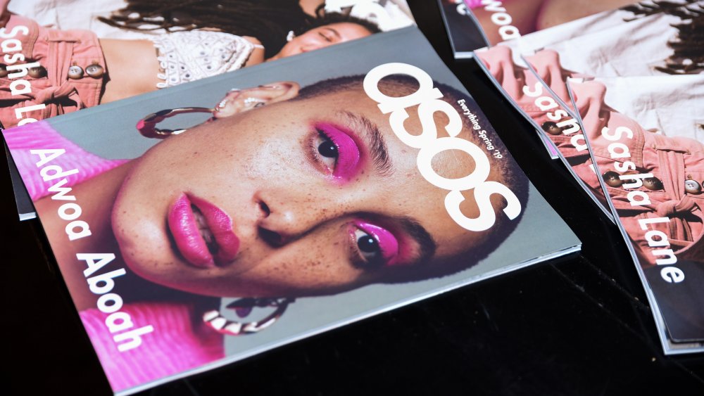 ASOS catalogs on a surface