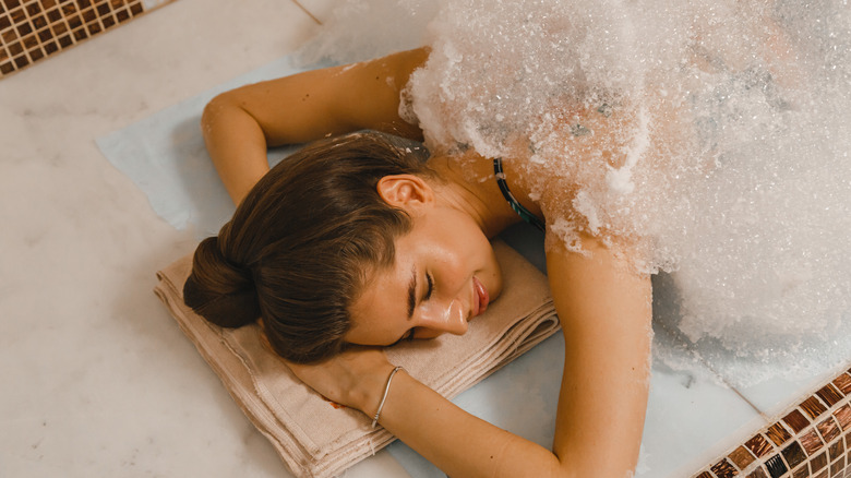 Woman getting a hammam bubble massage