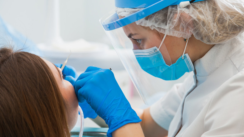 Woman getting dental treatment 