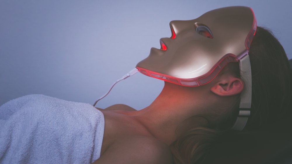 Woman in light therapy mask