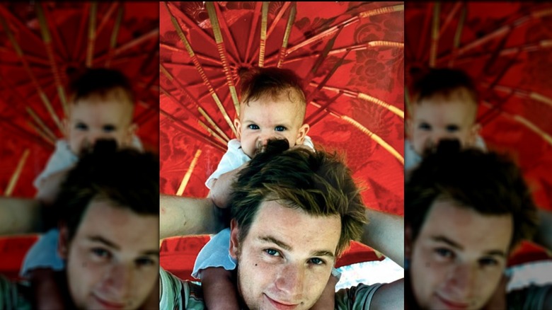 Baby Clara McGregor sitting on Ewan McGregor's shoulders
