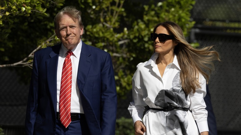 Donald and Melania Trump walking