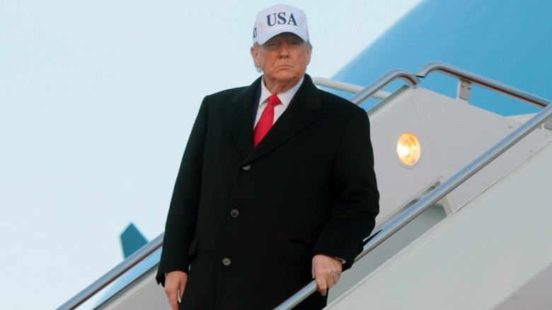 Donald Trump walks down the stairs of Air Force One at Joint Base Andrews, MD (2026)