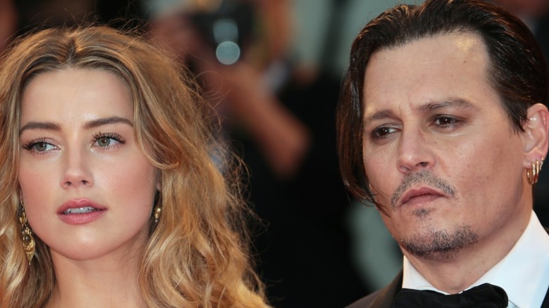 Amber Heard and Johnny Depp posing on the red carpet