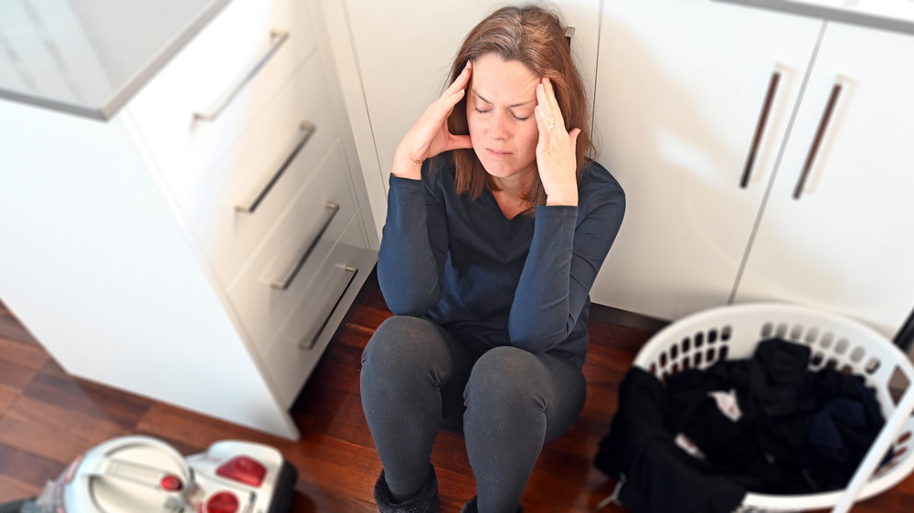 Frustrated woman cleaning