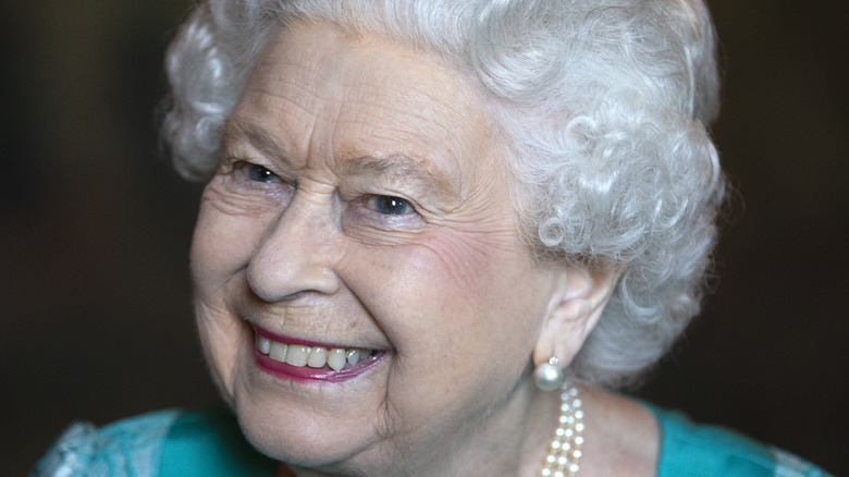 Queen Elizabeth smiles for a photo. 