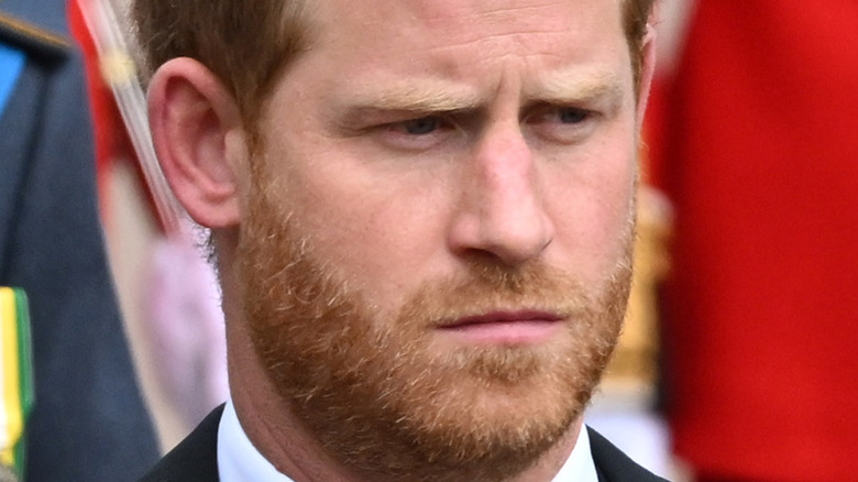 Prince Harry looking sad at queen's procession