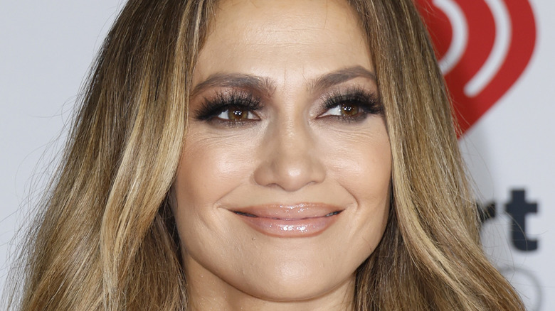 Jennifer Lopez smiling on the red carpet