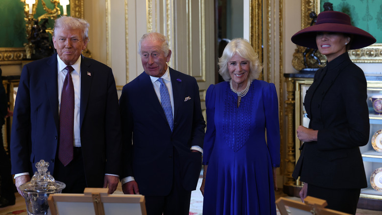 Donald Trump, King Charles III, Queen Camilla, and Melania Trump smiling