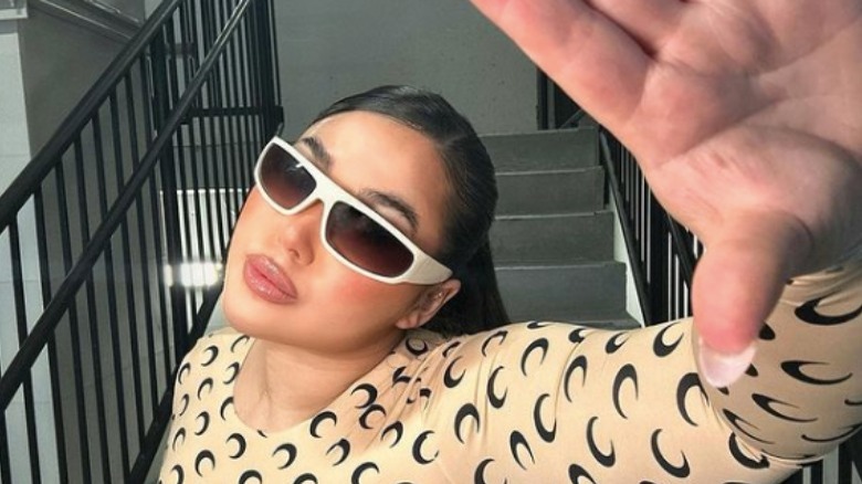 Woman taking selfie in sunglasses 
