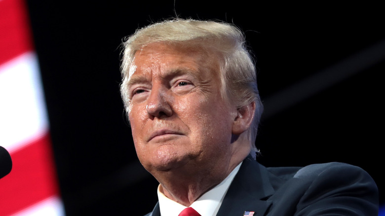 Donald Trump looking serious at podium