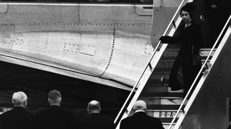 Queen Elizabeth II arrives at London airport after her father King George VI's passing on February 7, 1952