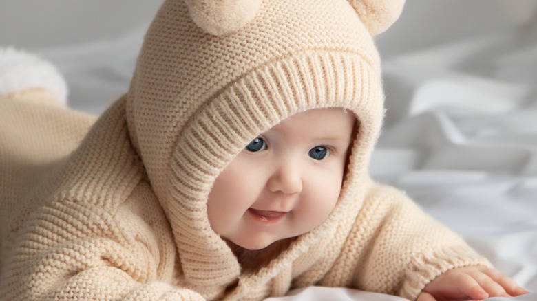 smiling baby in hoodie