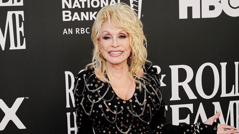 Dolly Parton posing on step-and-repeat