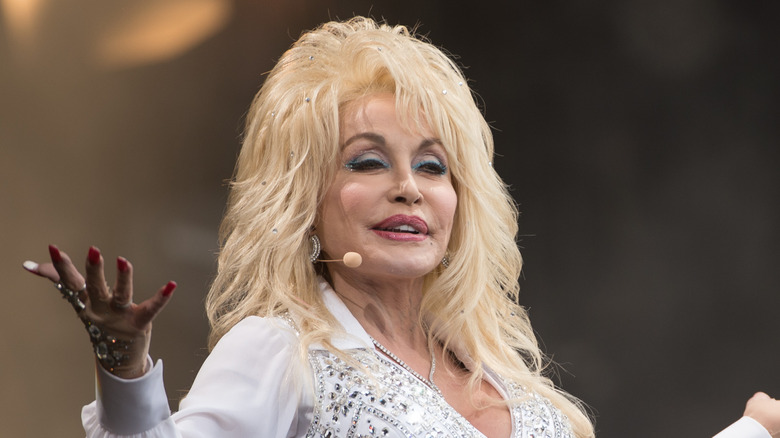 Close-up of Dolly Parton on stage wearing microphone headset
