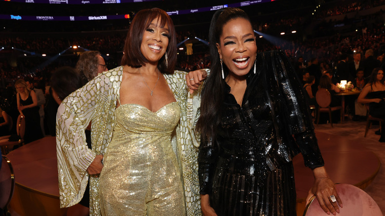 Gayle King and Oprah Winfrey smiling