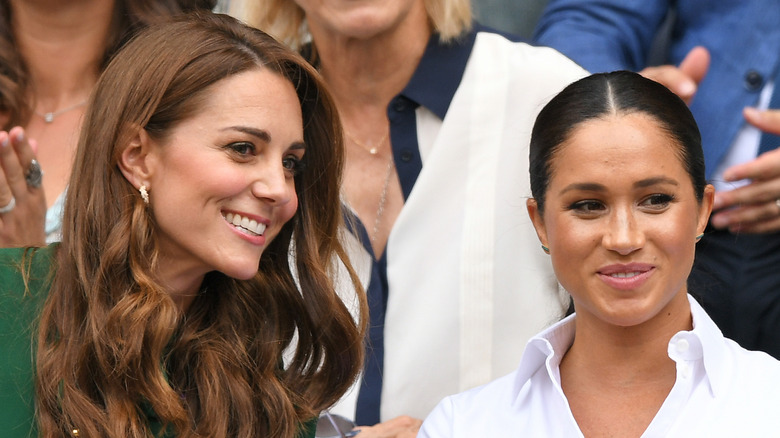 Meghan Markle and Kate Middleton smiling