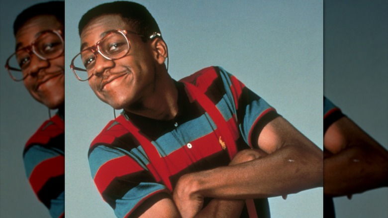 Jaleel White as Steve Urkel crossing his arms and smiling