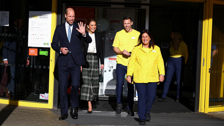 Prince William, Kate Middleton, and workers walking out of IKEA