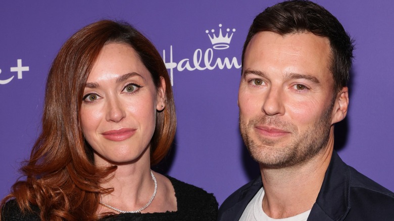 Sarah Power and Peter Mooney wearing matching black outfits at a premiere
