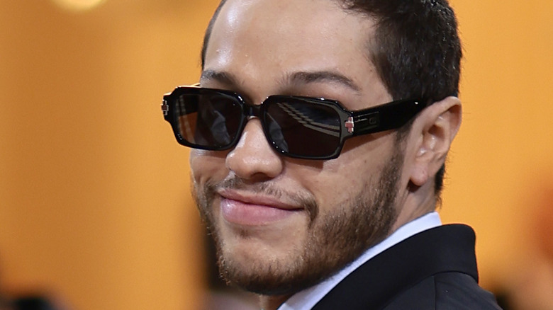 Pete Davidson looking smug in sunglasses