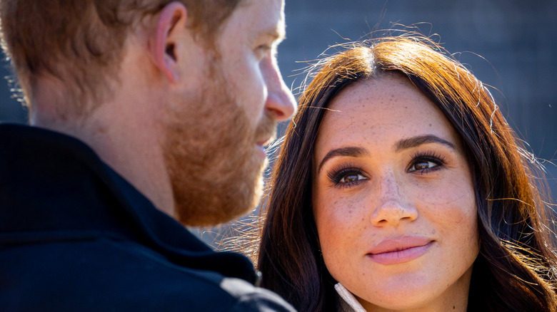 Meghan Markle looking at Prince Harry