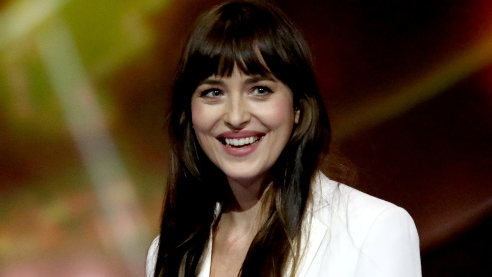 Dakota Johnson smiling broadly