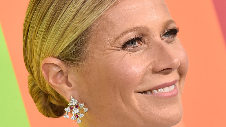 Gwyneth Paltrow smiling with diamond earrings 