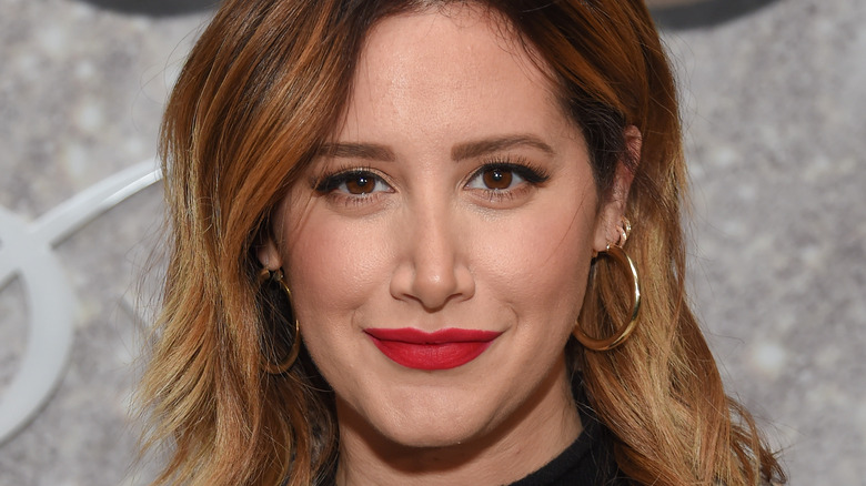 Ashley Tisdale soft smiling with red lipstick