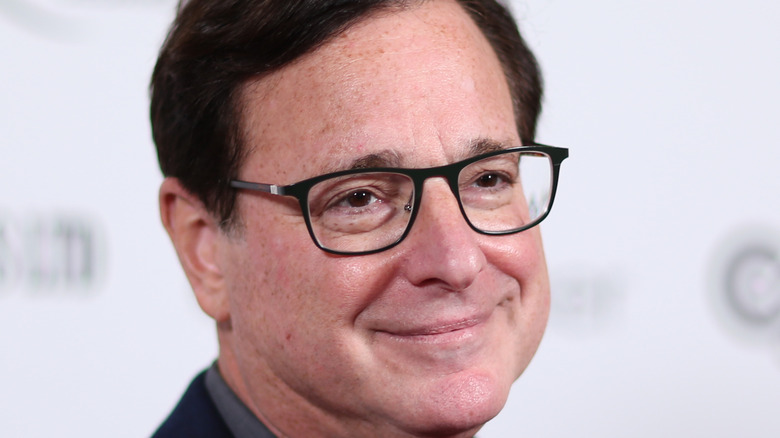 Bog Saget smiling on the red carpet. 